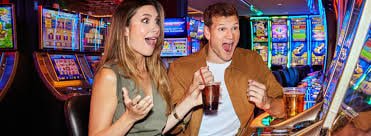 Fortune Tiger slot game on editoto login mobile phone showing spinning reels and payout symbols